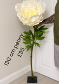 Giant ivory artificial peony with layered petals and green leaves; display stand not included